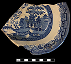 Refined white earthenware vegetable dish printed underglaze in Blue Willow pattern. Impressed Davenport anchor mark. Vessel height:  1.75”, Lot: 18BC27/339.
